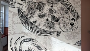 A fish pattern on a wall.