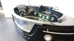 A black hot tub with a chrome finish, a control panel with buttons, and a small circular window. - Vacation Home in Otranto with 1 bedrooms sleeps 2 (Otranto)