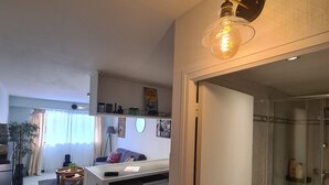 A modern apartment with a kitchen, dining area, and a glass-enclosed shower. - Large Studio very well located! 100m tramway, 5 minutes downtown, 10min beach! (Nice)