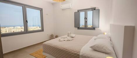 Apartment, 1 Bedroom, City View | Pillowtop beds, soundproofing, iron/ironing board, free WiFi