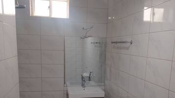Shower, towels, soap, toilet paper