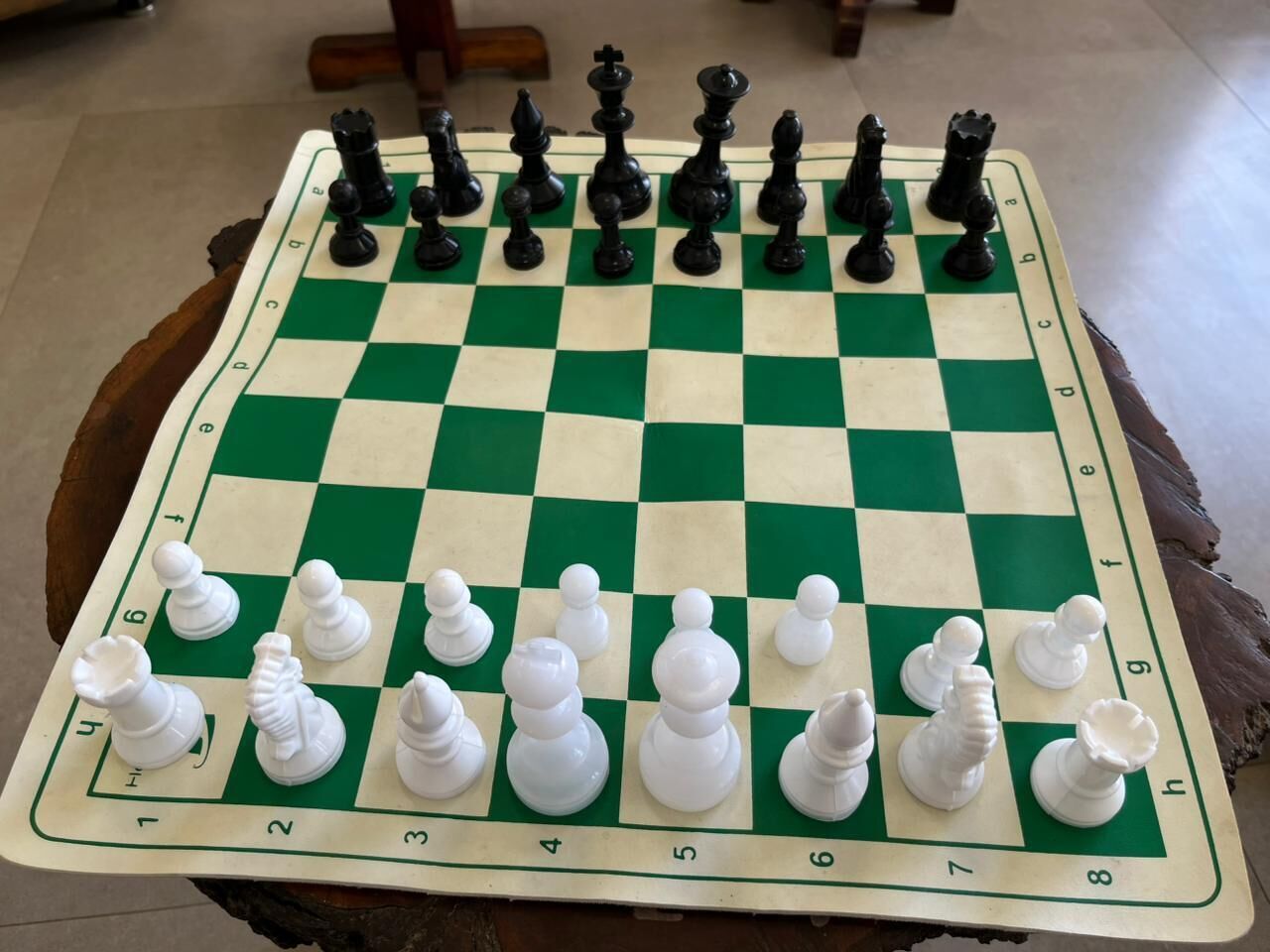 A chessboard with pieces set up for a game.