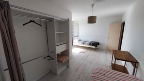 A room with a bed, a wardrobe, a hanging chair, and a small table. - Spacious house for large family or group - Near Villejuif Metro Line7 (Villejuif)