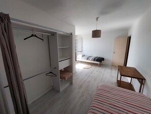 A room with a bed, a wardrobe, a hanging chair, and a small table. - Spacious house for large family or group - Near Villejuif Metro Line7 (Villejuif)