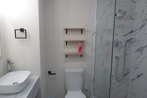 Shower, hair dryer, towels, soap - 202 Batts Rock Beach Condos 1 Bedroom Suite (Bridgetown)