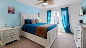 A bedroom with a bed, nightstand, dresser, ceiling fan, and a window with curtains. - Minutes to Disney | Cozy 3BR Florida Escape (Kissimmee)