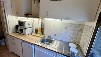 Appartement | Privékeuken | Een kinderstoel