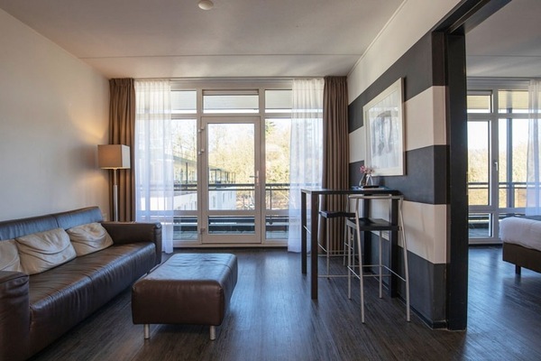 Living area. Exact unit will be assigned upon arrival. Views, colors, and decor may vary.