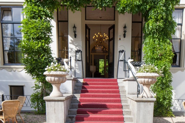 Step inside through ivy-framed doors into timeless elegance.