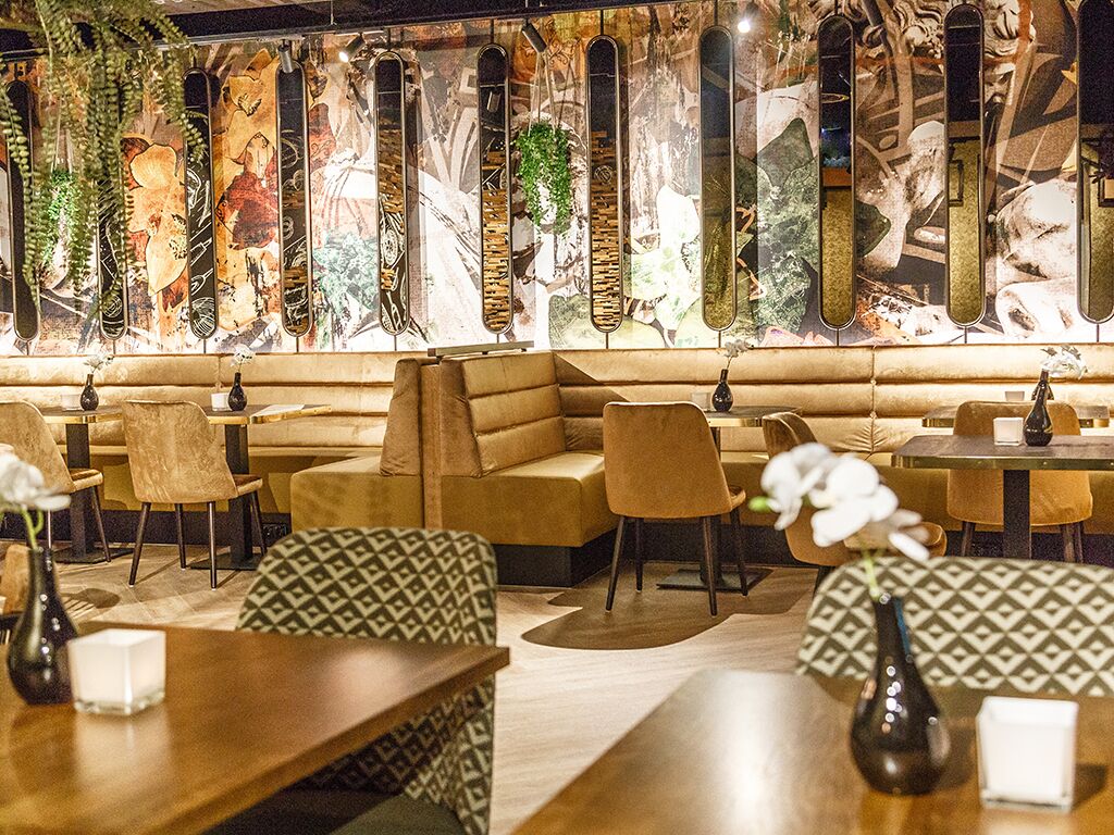 Settle into plush banquettes for relaxed conversation and shared plates