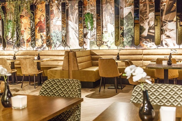 Settle into plush banquettes for relaxed conversation and shared plates