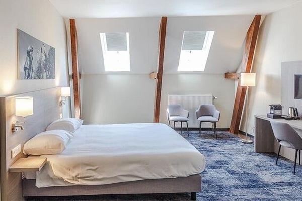 Settle into a roomy top-floor retreat with skylit charm.
