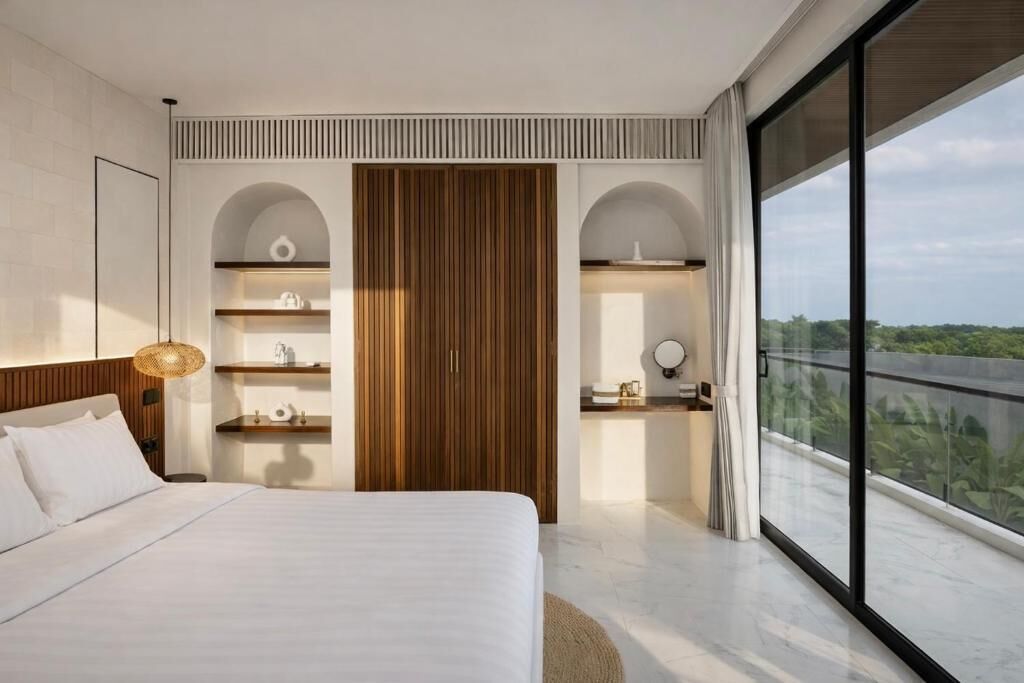 A modern bedroom with a large bed, built-in wooden wardrobe, and a balcony with a view.
