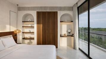 A modern bedroom with a large bed, built-in wooden wardrobe, and a balcony with a view.