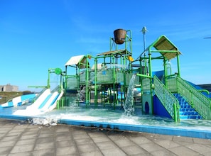 A water park with multiple slides and water features.