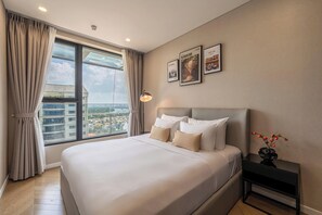 Luxury Apartment, 2 Bedrooms, Balcony, City View | Free minibar, desk, blackout drapes, soundproofing - Honey West Lumiere Riverside  (Thu Đuc)