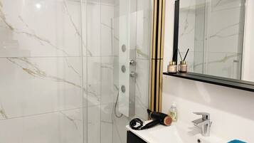 Shower, hair dryer, towels, soap