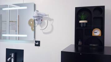 Shower, hair dryer, towels, soap