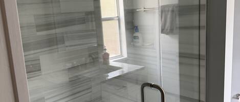 Shower, towels, soap, toilet paper