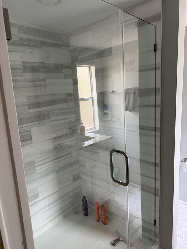 Shower, towels, soap, toilet paper