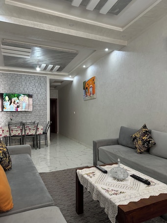 Living area. Enjoy staying in a calm apatment- near the beach with air conditioning and wifi
