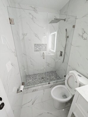 Shower, hair dryer, towels, soap