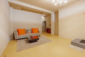 A modern living room with a sofa, coffee table, and a small rug. - COLORFUL STUDIO 3 MUNICIPAL POOL by VACATIONY (Oporto)