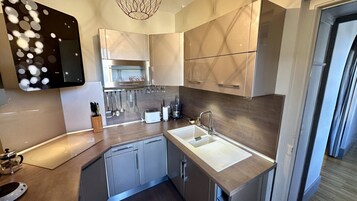 Apartamento | Cocina privada | Trona infantil