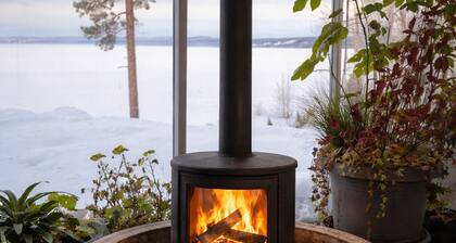 Modern lake house with outdoor bathtub and fireplace - quiet location