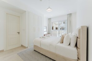 Exclusive Apartment, 1 King Bed, Air conditioning, Pool View | In-room safe, blackout curtains, soundproofing, iron/ironing board - PVH - Mayas Geneva - 1BR Plus Maids Room (Dubai)