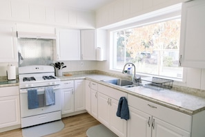 Fridge, microwave, oven, stovetop - Fully Renovated 4BR/2BA • 5 Min to Beach • Modern Coastal Retreat (Sebastian)