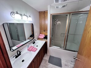 Jetted bath, hair dryer, towels, toilet paper