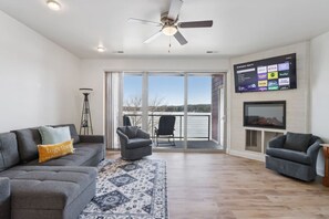 TV, fireplace - Jane`s View of the Beach, a waterfront condo (Wisconsin Dells)