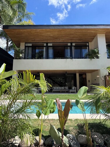 Open the back gate, walk 5’ down a jungle trail and arrive to Playa Hermosa