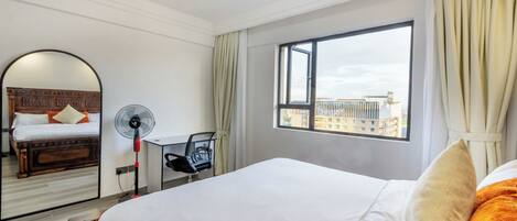 Deluxe Apartment, Balcony, City View | In-room safe, soundproofing, iron/ironing board, free WiFi