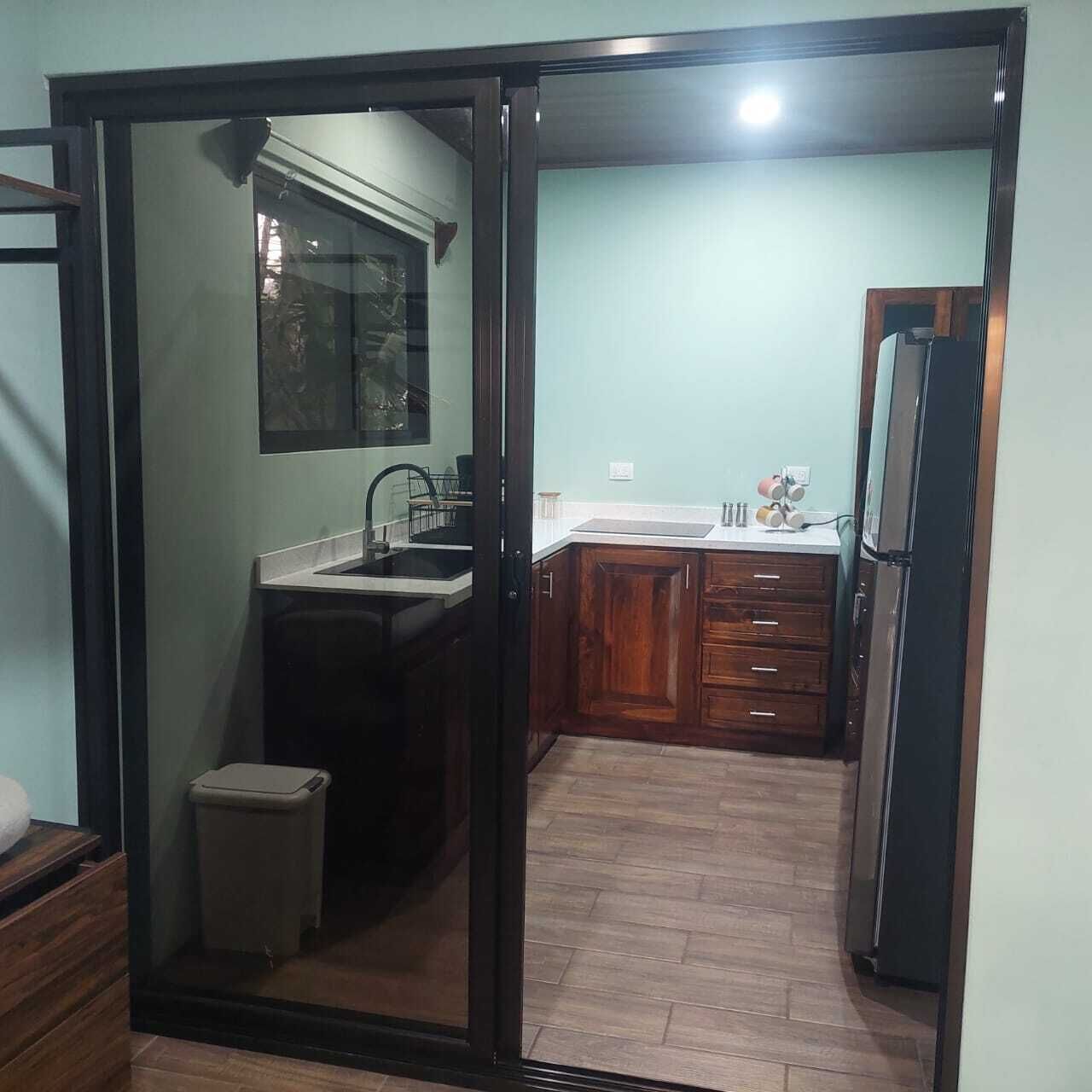 Fridge, microwave, stovetop, coffee/tea maker