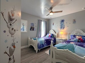 A bedroom with two beds, a ceiling fan, and a window with curtains. - Luxury Villa Near Disney 6 Bd Home With Private Pool And Resort 6 Bedroom Home (Davenport)