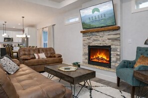 TV, fireplace - Land of the Pines | Single-Level Blue Ridge Retreat Near Asheville + Biltmore (Fairview)