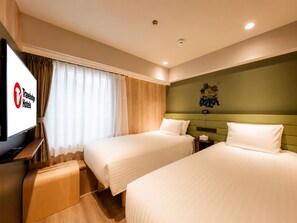 A hotel room with two beds, a television, and a wall-mounted artwork. - Travelodge Osaka Shinsaibashi (Osaka)