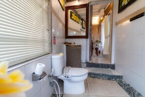 A compact bathroom with a toilet, bidet, and sink. - Room-romantic Jungle Nest (Ubud)