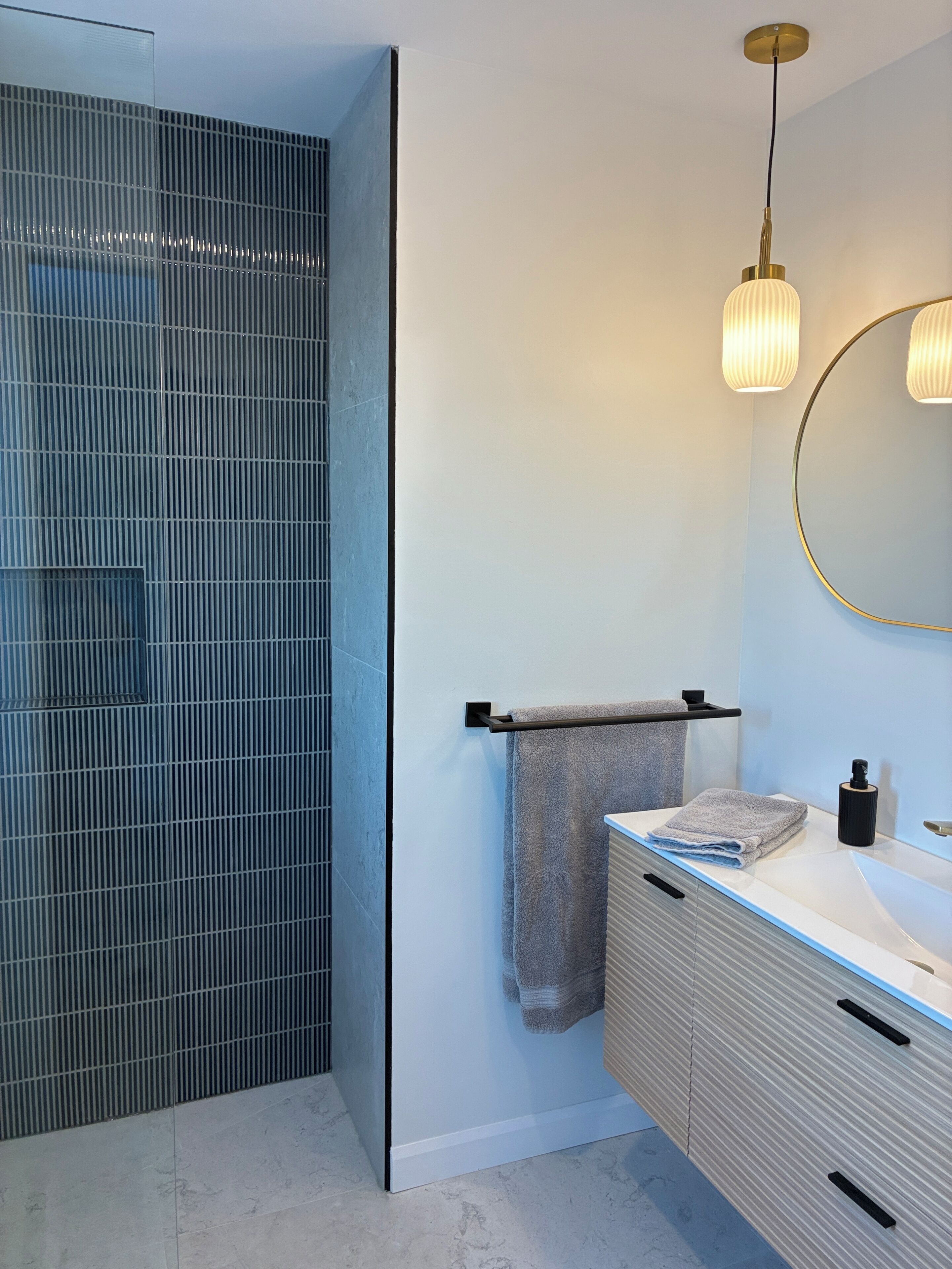 Shower, hair dryer, towels, toilet paper