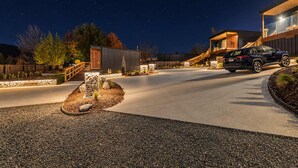 A modern building with a car parked in front. - Starry Retreat | Lake Views + Fireplace (Lake Tekapo)