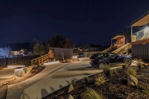 A residential driveway leading to a house with a car parked in the driveway. - Starlight Escape - Ohana (Lake Tekapo)