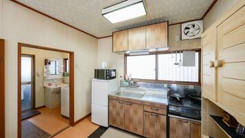 Fridge, microwave, coffee/tea maker, cookware/dishes/utensils