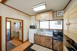 Fridge, microwave, coffee/tea maker, cookware/dishes/utensils