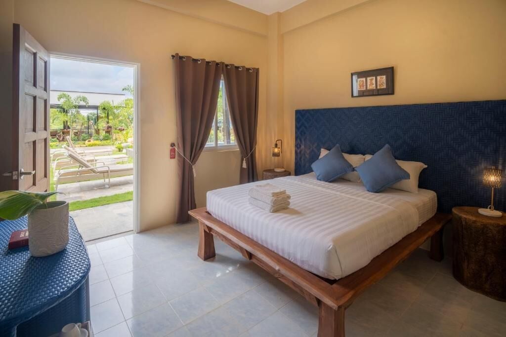 Deluxe Double Room, Pool View | Minibar, individually furnished, desk, laptop workspace