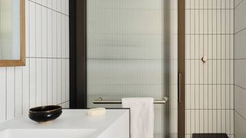 Shower, rainfall showerhead, designer toiletries, hair dryer