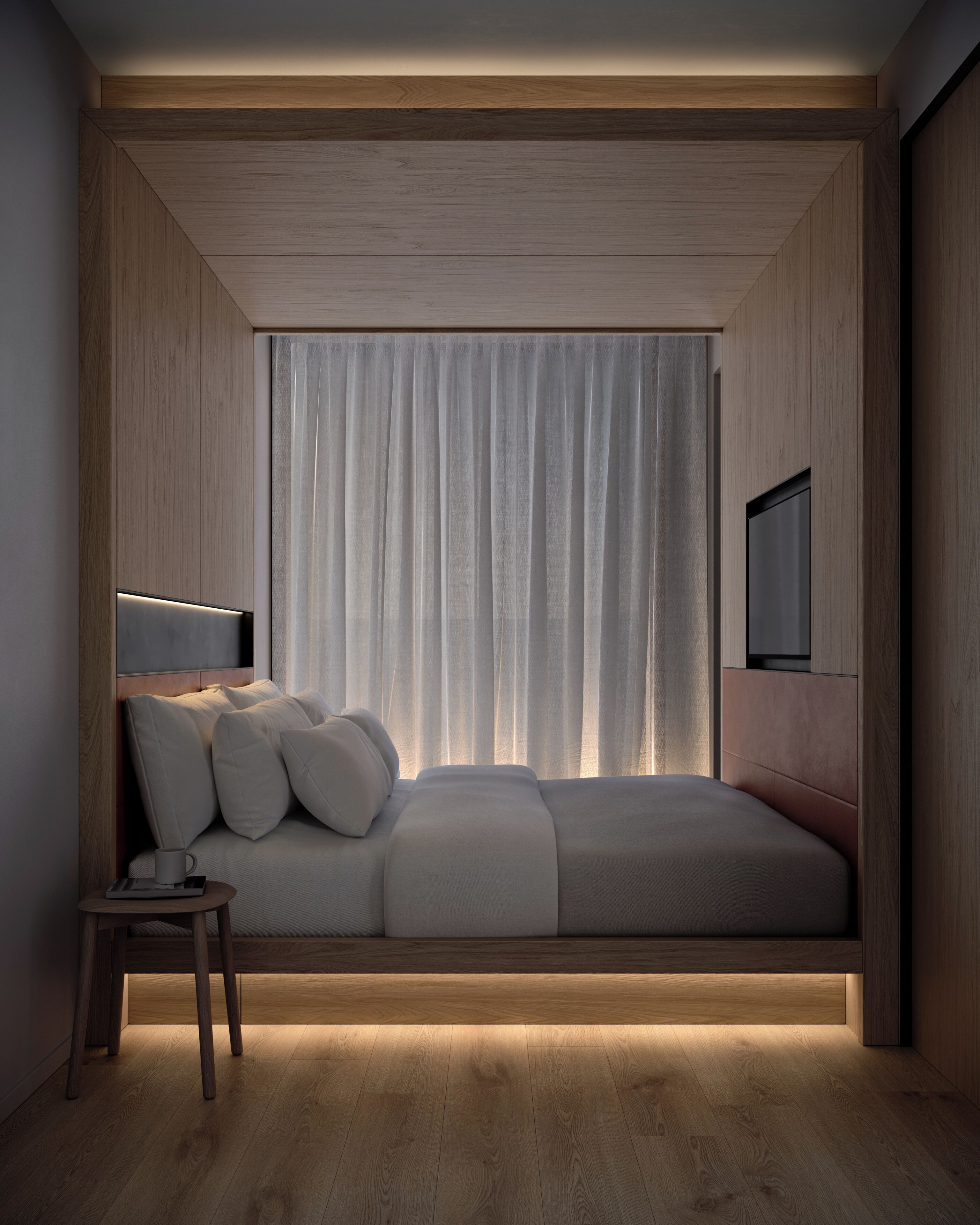 Un dormitorio moderno con una cama, una mesita de noche, una lámpara y un televisor instalado en la pared.