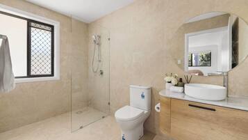 Shower, hair dryer, towels, shampoo