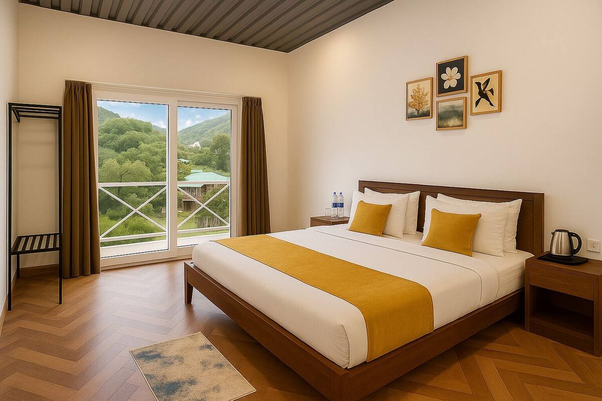 A hotel room with a large bed, a nightstand, a chair, and a view of greenery through the window.